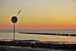 Sunset view from the Wadden Sea road between the mailland of Denmark and the island of Mandoe, Mandø Ebbevej